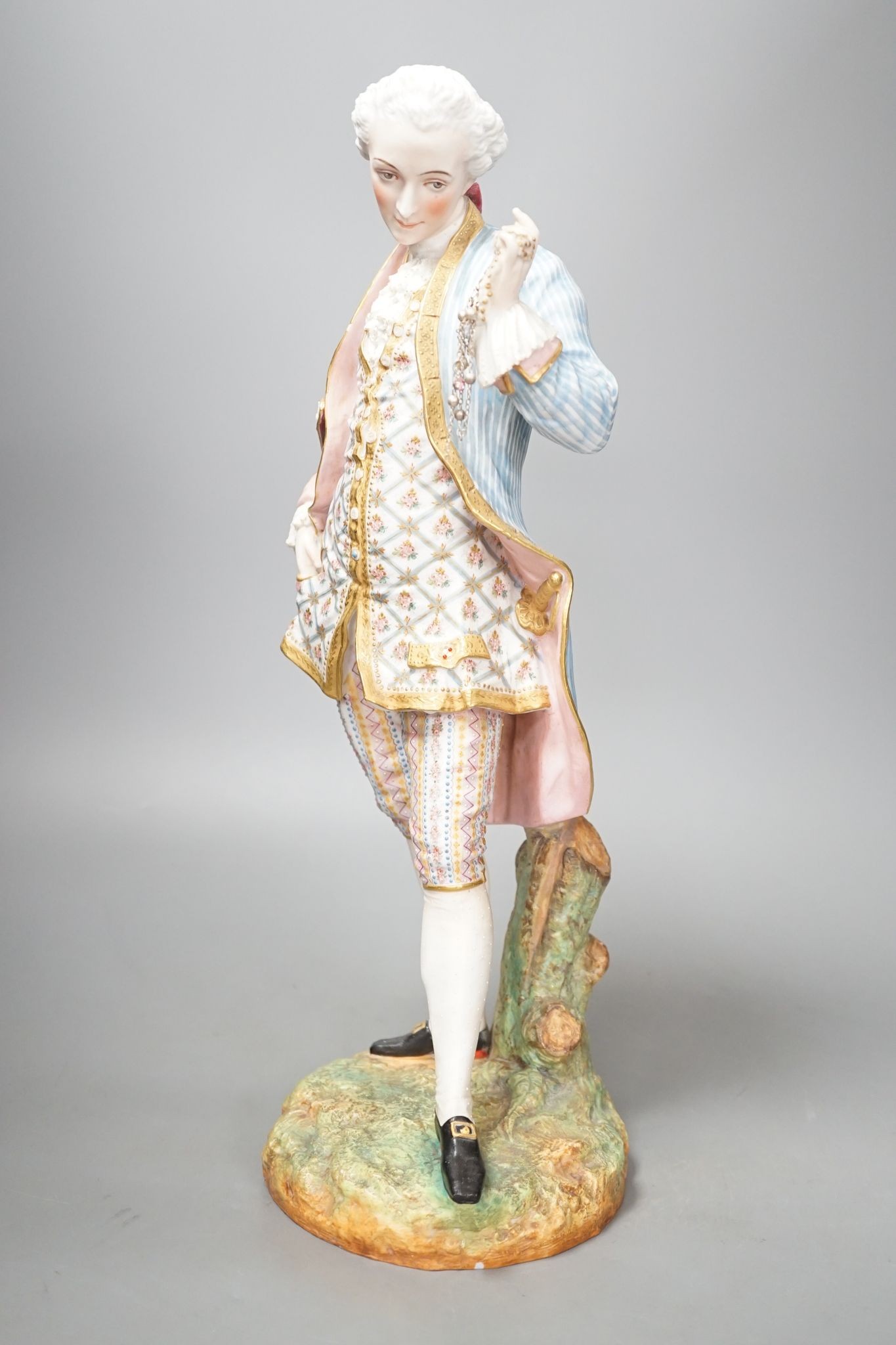 A large French coloured biscuit figure of a gentleman 42cm
